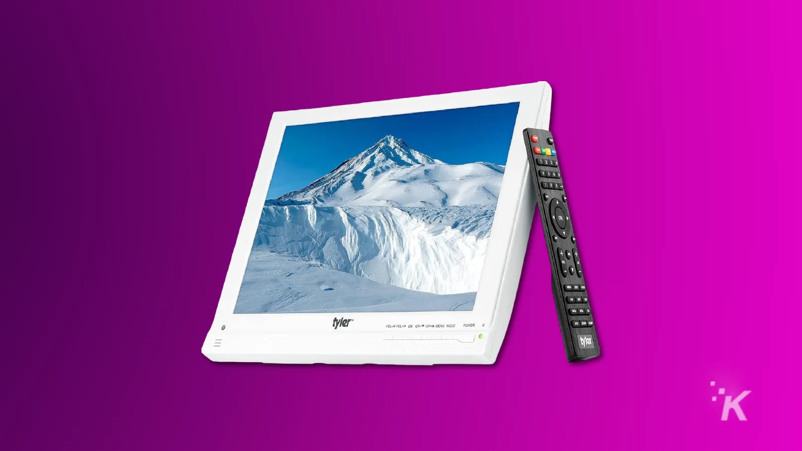 Digital photo frame displaying snowy mountain with remote control.