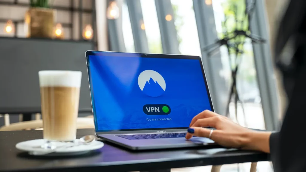 person typing on laptop. VPN showing on the screen.