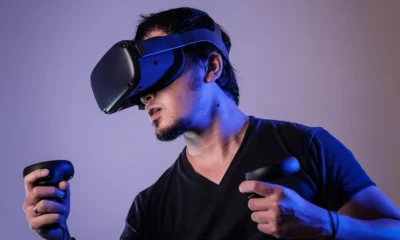 person wearing a VR headset with haptic feedback