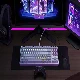 A keyboard and mouse sit on the desk.