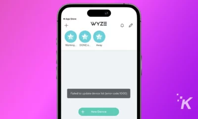 The image shows a smartphone displaying an error message "Failed to update device list (error code 1000)" in the WYZE app on a pink background.