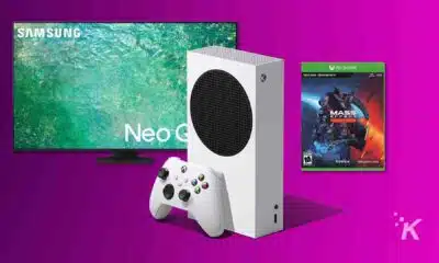 xbox series s with mass effect game next to tv