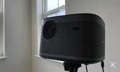 xgimi horizon pro projector on a stand, in a white room