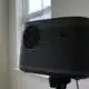xgimi horizon pro projector on a stand, in a white room