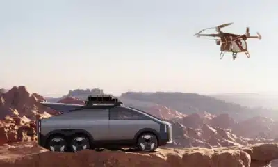 xpeng aeroht flying car in the air near the suv it is carried around in