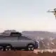 xpeng aeroht flying car in the air near the suv it is carried around in